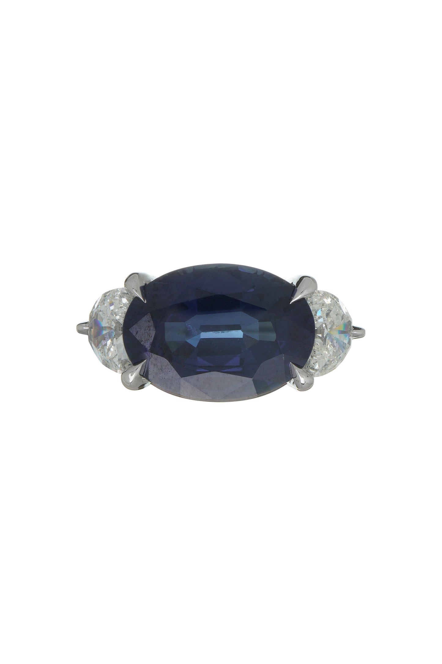 Blue sapphire ring with white diamonds in 18k white gold