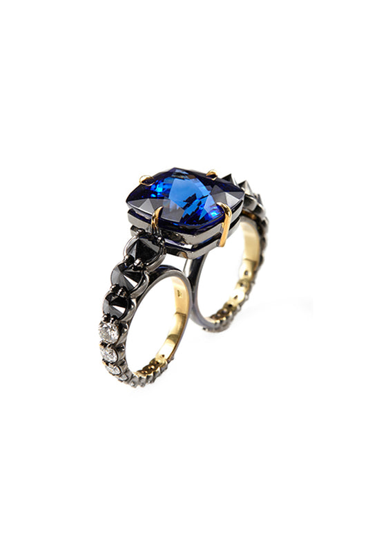 Tanzanite two-finger ring with inverted black diamonds and white diamonds in 18k yellow gold