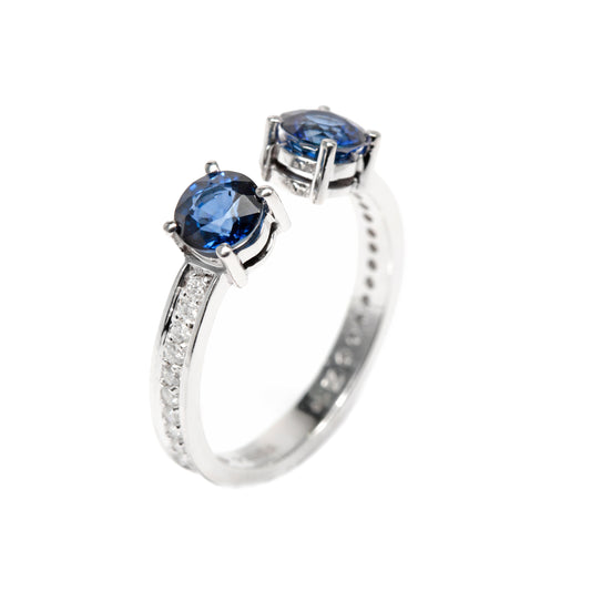 Blue sapphire ring with white diamonds in 18k white gold