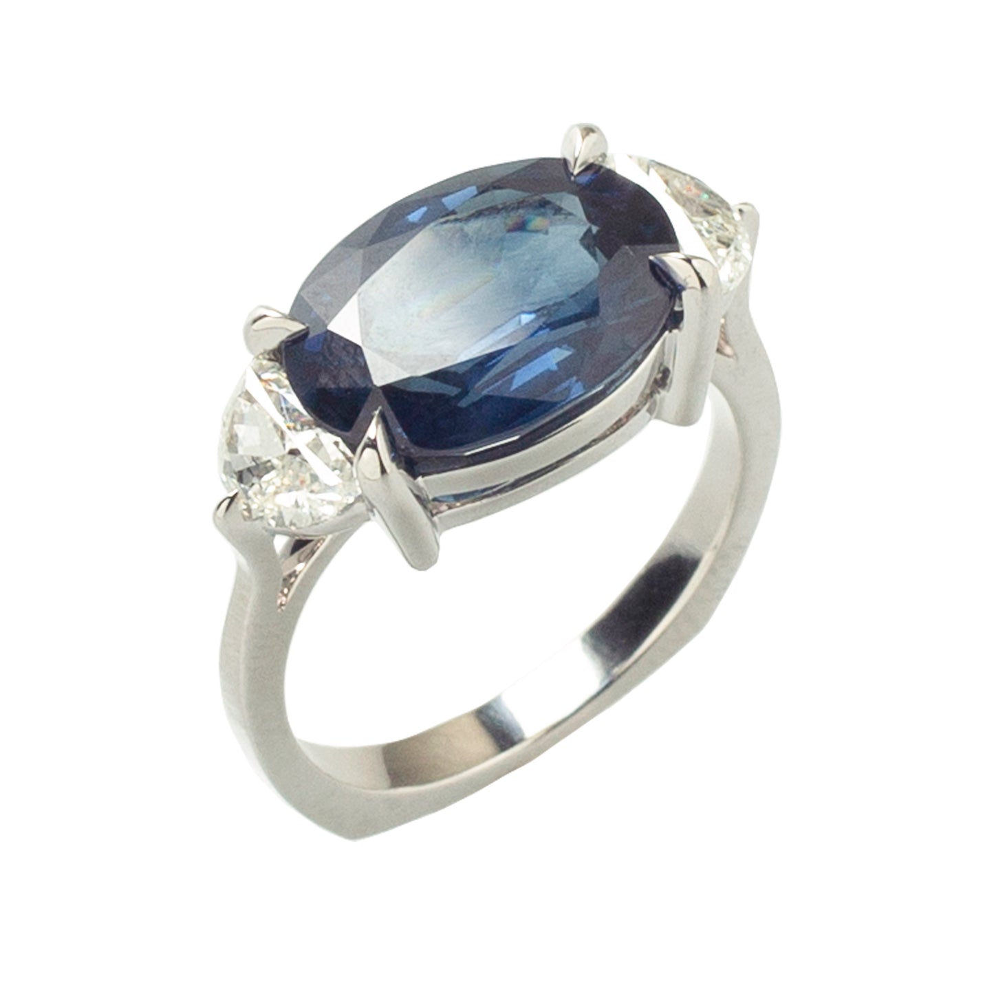 Blue sapphire ring with white diamonds in 18k white gold