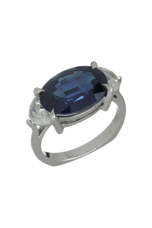 Blue sapphire ring with white diamonds in 18k white gold