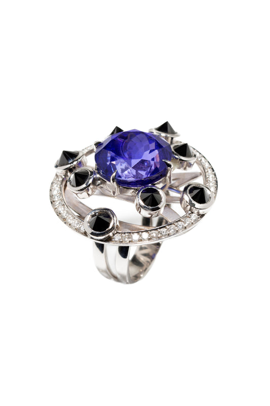 Tanzanite ring with inverted black diamonds and white diamonds in 18k white gold