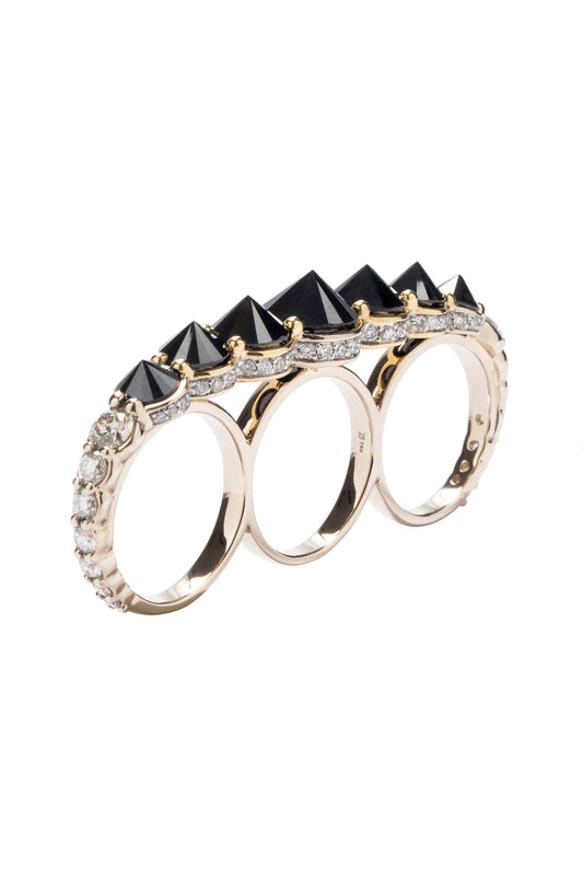 Inverted black diamond three-finger ring with white diamonds in 18k white and yellow gold