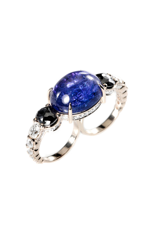 Tanzanite two-finger ring with black and white diamonds in 18k white gold